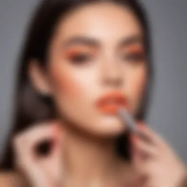 A beauty influencer applying peach-toned lipstick in natural light