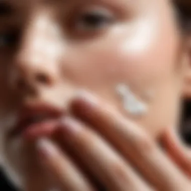 A close-up of a hand applying moisturizer on a smooth skin surface.