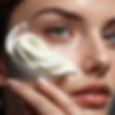 Close-up of a person applying a cream to their face in a calm environment