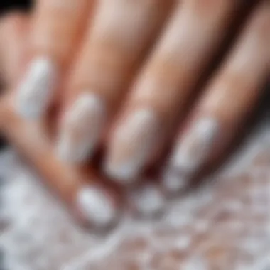 Intricate lace-inspired white nail art