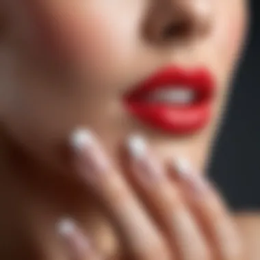 A close-up of a perfectly applied French tip on a nail.