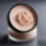 A close-up of a translucent setting powder in a makeup container