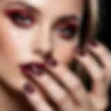 Glittering burgundy nail polish applied on a perfectly manicured nail.