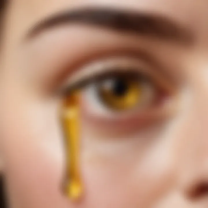 A close-up of a drop of vanilla oil being applied to the skin