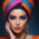 A stunning turbaned model showcasing a bold makeup look with vibrant colors.