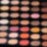 Close-up of a makeup palette showcasing various shades